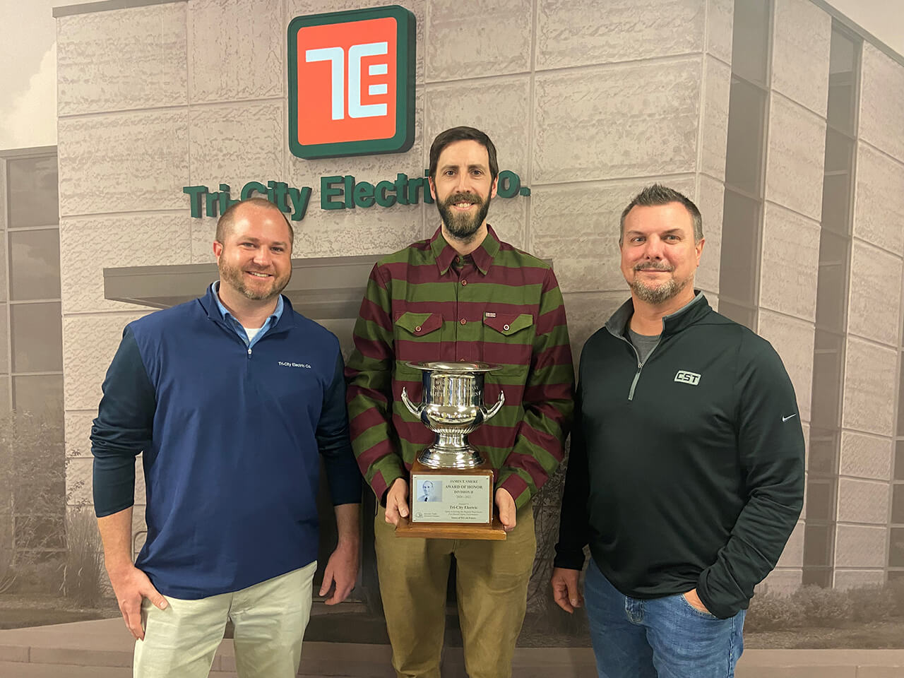 three men holding James T. Smerz Award of Honor - Safety - 2022