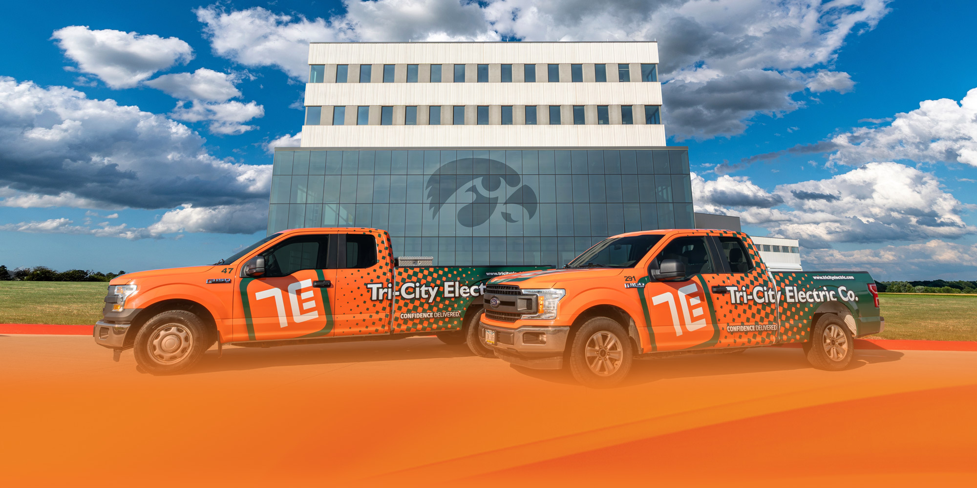 Tri-City Electric trucks in front of University of Iowa Health Care building